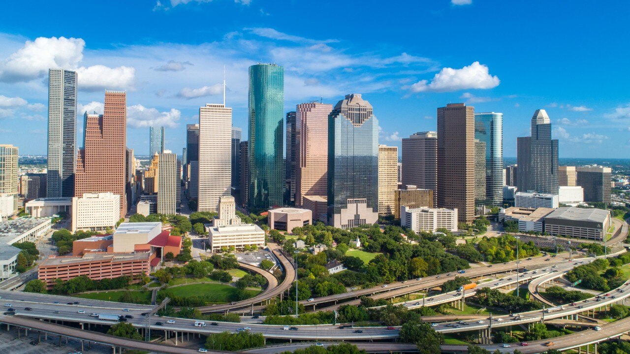 Aerial skyline photo of Downtown Houston building and freeway. Picture was taken at Buffalo Bayou Park in central Houston